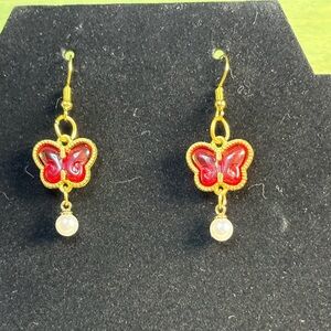 Red butterfly and faux pearl earrings
